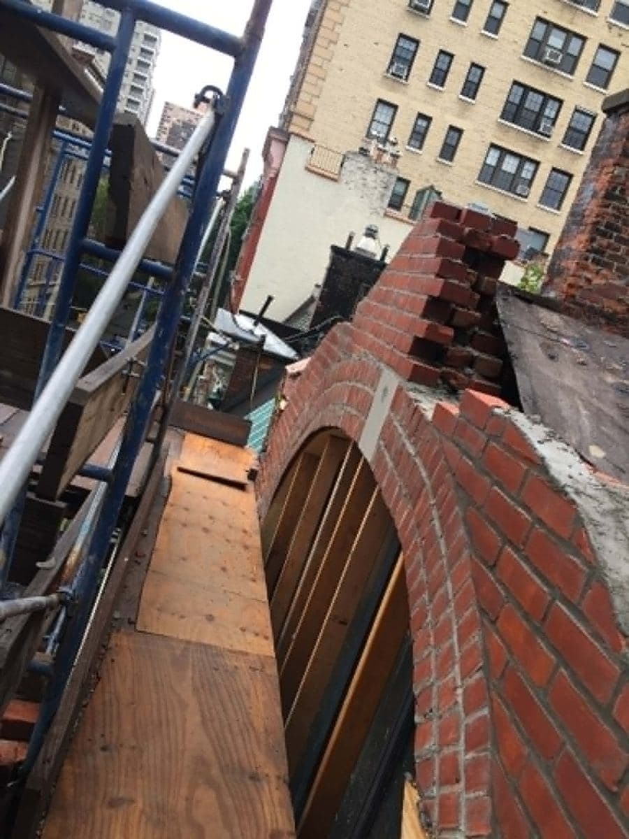 Brick arch taking shape during detailed masonry work