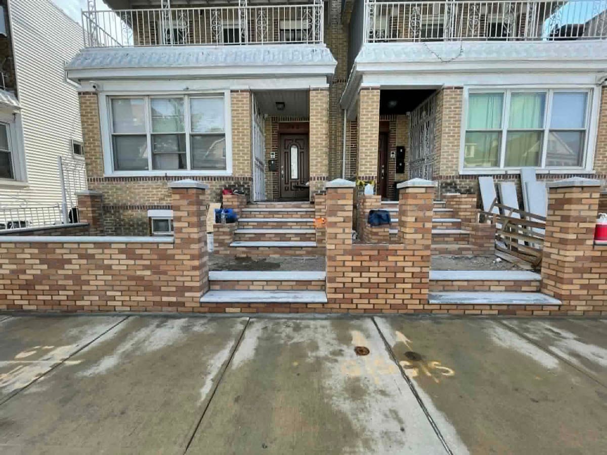 Brick masonry work on a residential property facade