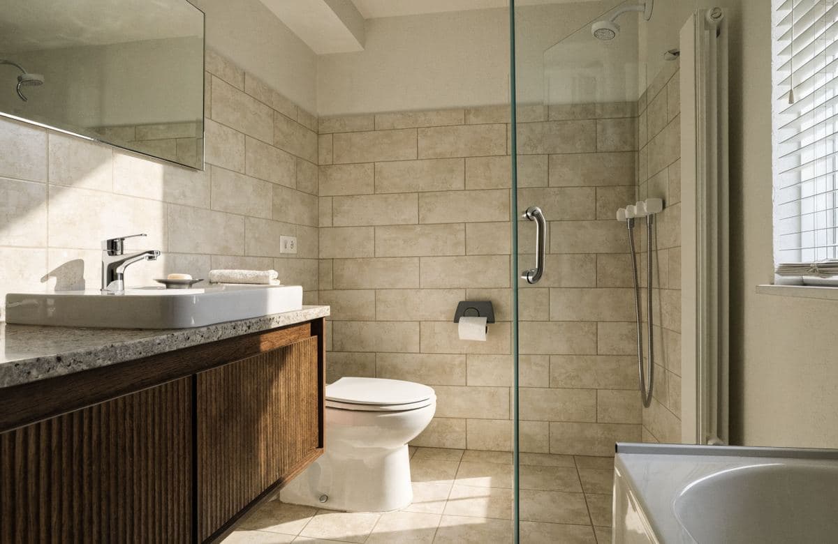 Illustrative finished apartment bathroom with new tile and vanity