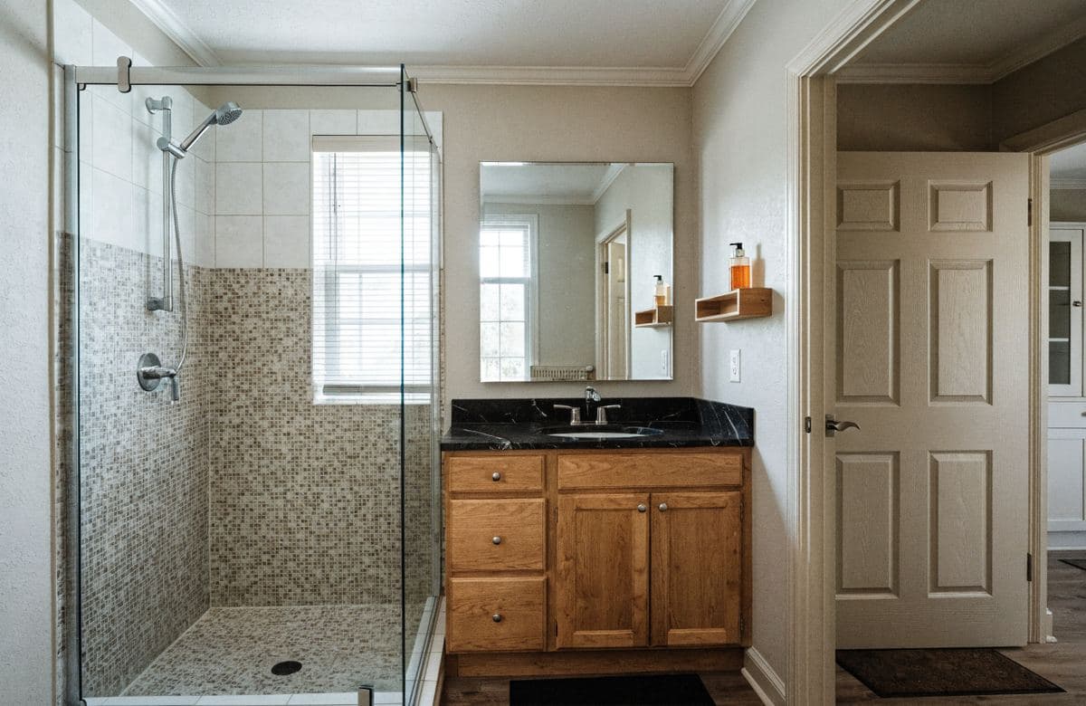 Illustrative finished single-family bathroom with a tile shower