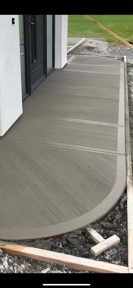 Finished concrete surface with a clean curved edge at a building entrance