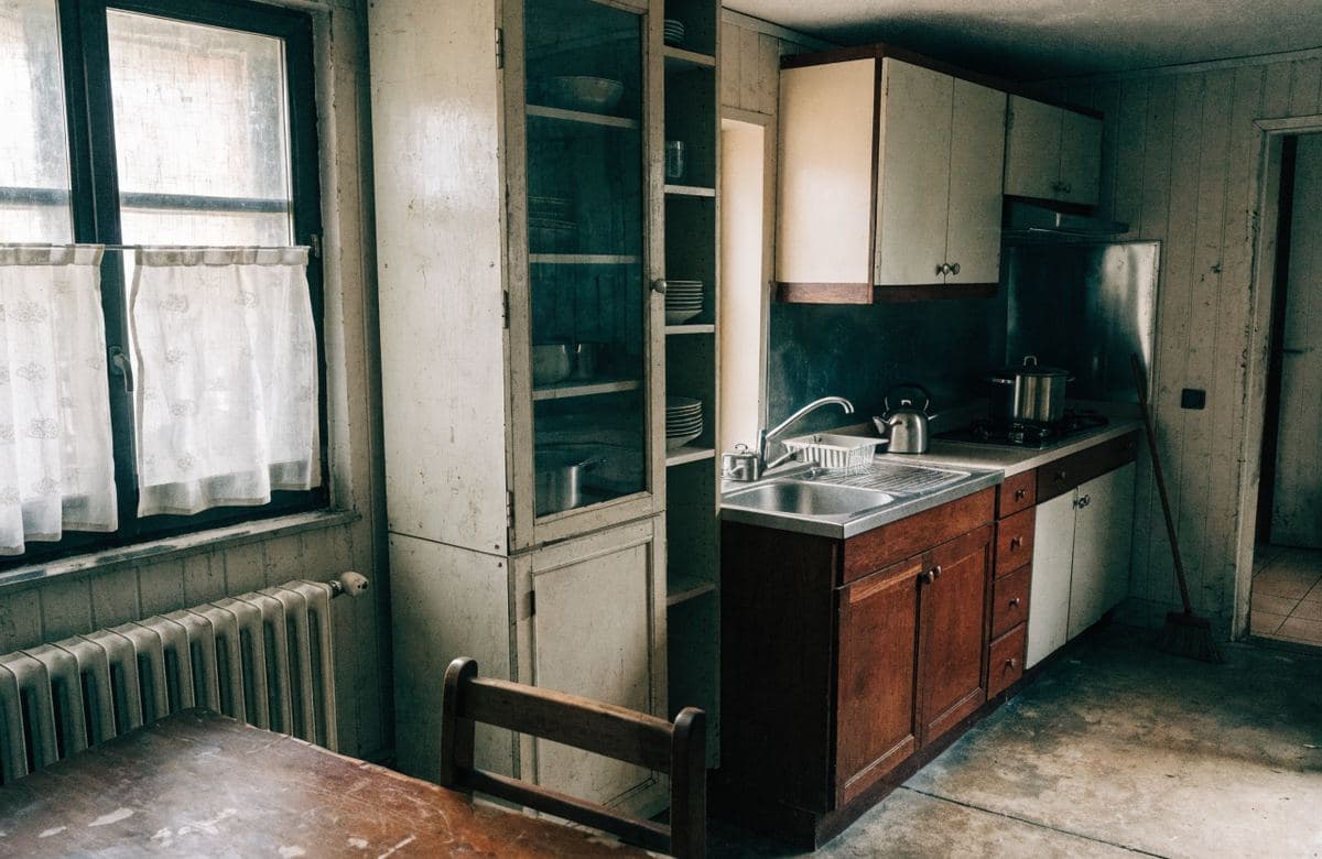 Illustrative outdated cramped kitchen with an inefficient layout