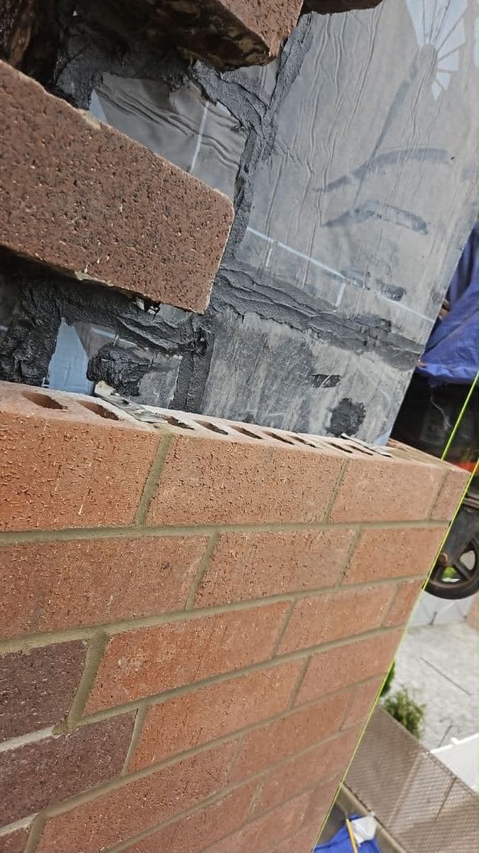 Close view of brick corner courses and finished mortar joints