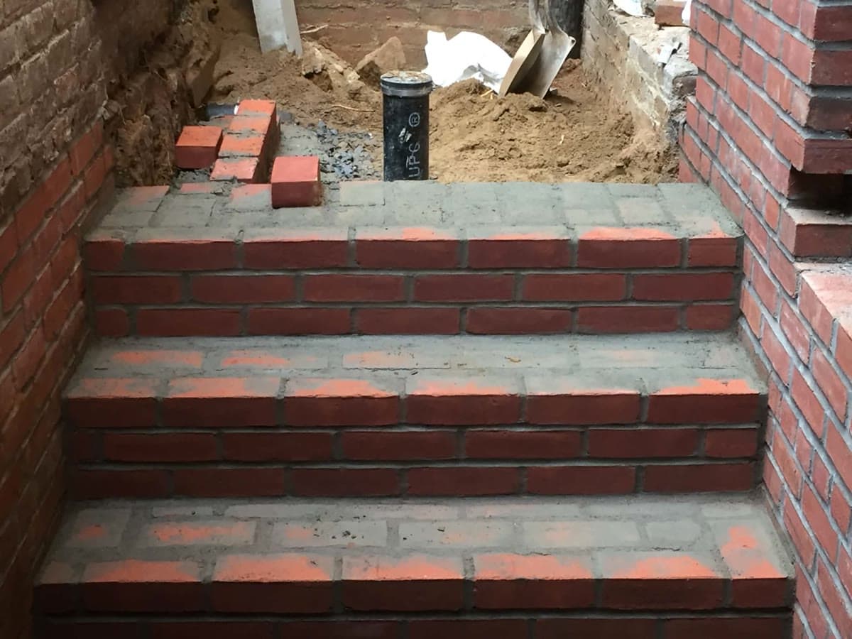 Brick step construction work in progress on a residential entry