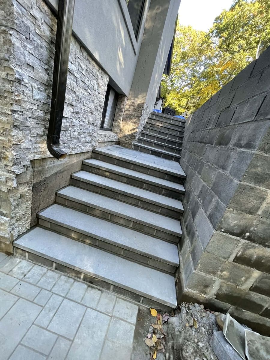 Exterior masonry steps beside a residential entrance