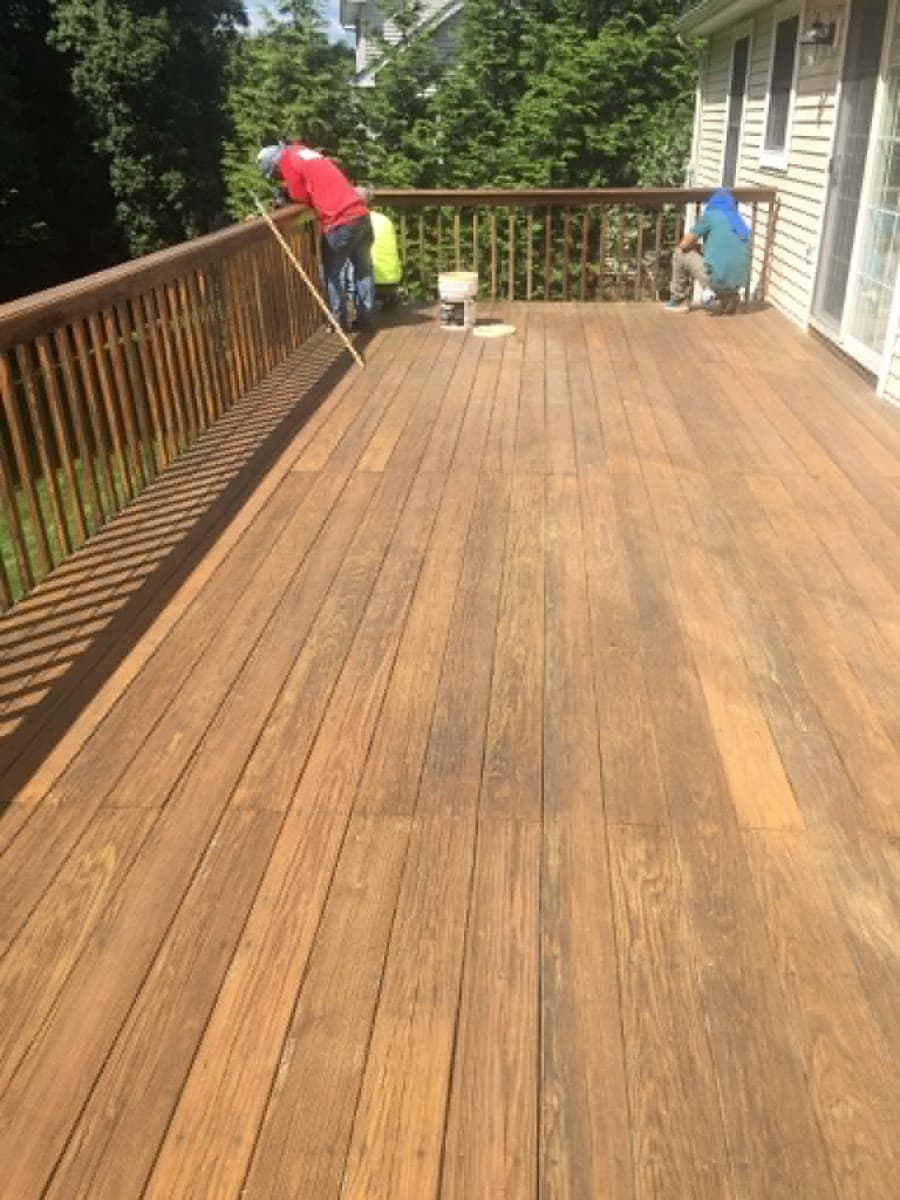 Finished exterior deck surface after painting and sealing work