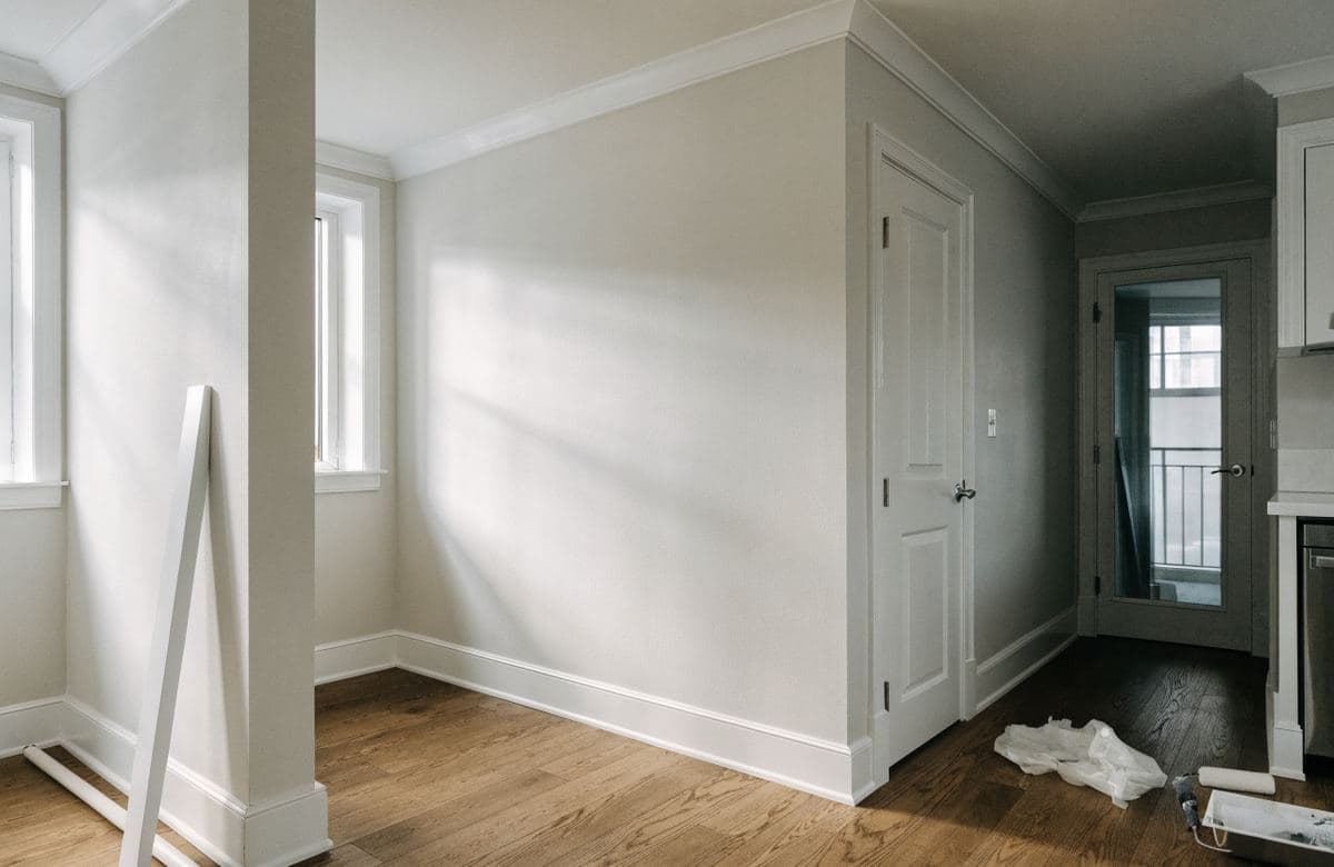 Illustrative freshly painted condominium room with crisp trim