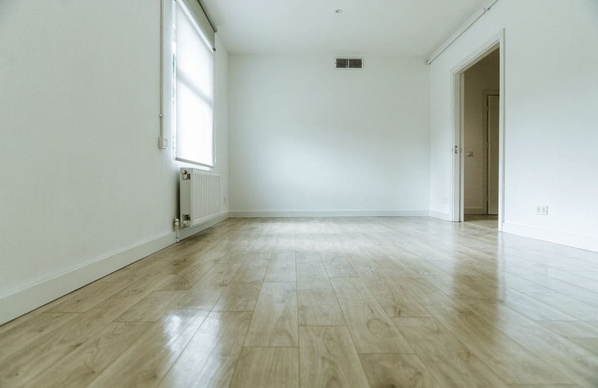 Illustrative freshly cleaned room with walls prepared for new tenants