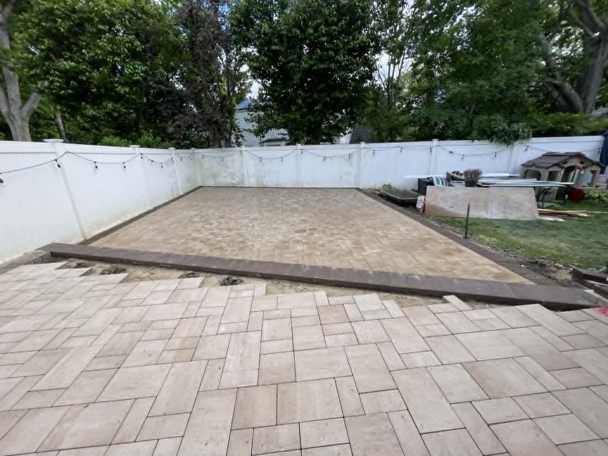 Completed residential yard with a new paver surface