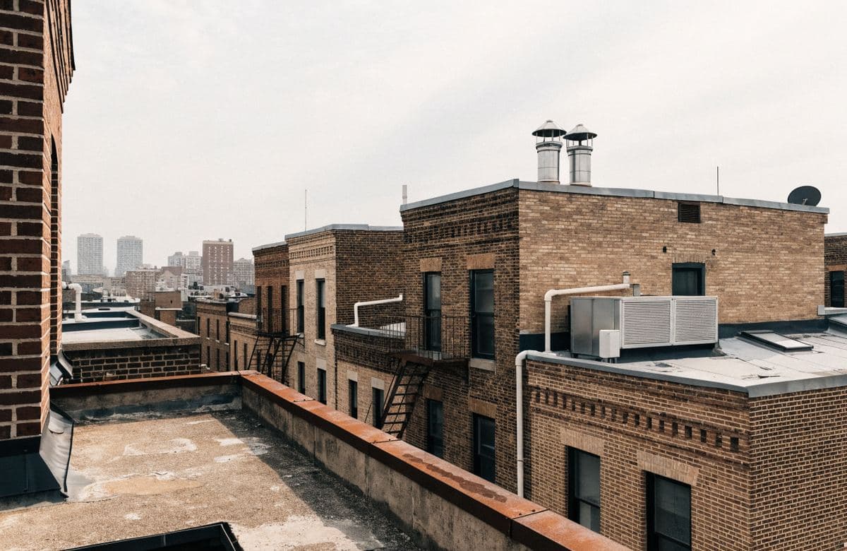 Illustrative multifamily rowhouses with adjoining flat roofs